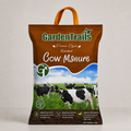 Bag of Garden Trails Cow Manure with cows in a field on the label
