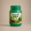 Green jar of GardenTrails Neem Oil for plants on a beige background